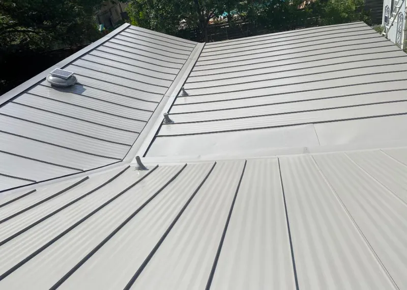 Solar attic fan installed on a metal roof for Roof Ventilation in Escondido